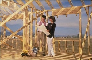 two people in house under construction